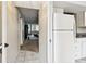 Welcoming hallway flows seamlessly into the living area, adjacent to the kitchen at 2614 Cove Cay Dr # 207, Clearwater, FL 33760