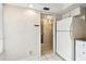 Galley kitchen with classic white appliances, easy access to bathroom and bedrooms at 2614 Cove Cay Dr # 207, Clearwater, FL 33760