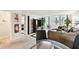 Open concept living room with neutral colors, leading to a balcony with a view at 2614 Cove Cay Dr # 207, Clearwater, FL 33760