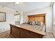 Bedroom with a stylish bed, side table with lamp, and a view of the bathroom at 2614 Cove Cay Dr # 207, Clearwater, FL 33760