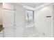 Bright pantry area features built-in storage, granite countertops, and tile flooring at 2614 Cove Cay Dr # 207, Clearwater, FL 33760