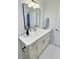 Chic bathroom vanity with quartz countertop, sleek mirror, and contemporary fixtures at 2869 Thistle N Ct, Palm Harbor, FL 34684