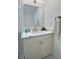 Stylish bathroom vanity with quartz countertop, sleek mirror and modern fixtures offers a luxurious touch at 2869 Thistle N Ct, Palm Harbor, FL 34684
