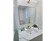 Elegant bathroom vanity with quartz countertop, sleek mirror, and stylish fixtures offering a touch of sophistication at 2869 Thistle N Ct, Palm Harbor, FL 34684