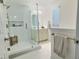 Bright bathroom with glass shower, white cabinets, and modern fixtures offer a spa-like experience at 2869 Thistle N Ct, Palm Harbor, FL 34684