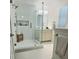 Stylish bathroom showcases a glass shower, modern fixtures, and ample natural light at 2869 Thistle N Ct, Palm Harbor, FL 34684