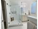 Beautiful bathroom featuring a glass shower, white cabinets, and modern fixtures for a luxurious feel at 2869 Thistle N Ct, Palm Harbor, FL 34684