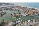 Overhead shot of waterfront homes with private boat docks, nestled in a serene canal community near the beach at 301 Boca Ciega Dr, Madeira Beach, FL 33708