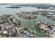 Aerial view of waterfront properties with boat docks and canal access, near the ocean at 301 Boca Ciega Dr, Madeira Beach, FL 33708