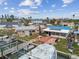 Backyard with houses near waterfront property, showing boat docks and outdoor living spaces at 301 Boca Ciega Dr, Madeira Beach, FL 33708