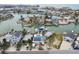 Stunning aerial view of waterfront homes with private docks and boats in a charming coastal community at 301 Boca Ciega Dr, Madeira Beach, FL 33708
