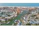 Expansive aerial of waterfront homes featuring private boat docks along tranquil canals, offering direct water access at 301 Boca Ciega Dr, Madeira Beach, FL 33708