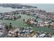 Aerial view of waterfront homes with canal access and boat docks, close to the beach at 301 Boca Ciega Dr, Madeira Beach, FL 33708