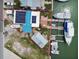 Aerial view of waterfront property with solar panels, boat dock, and canal access at 301 Boca Ciega Dr, Madeira Beach, FL 33708