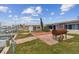 Backyard with a patio and barbecue grill, perfect for outdoor entertaining near the waterfront at 301 Boca Ciega Dr, Madeira Beach, FL 33708