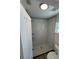 This modern bathroom features a tiled shower, decorative tile accent, and built-in shelves at 3924 Orchard Hill Cir, Palm Harbor, FL 34684