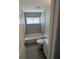 A bathroom featuring patterned tile, tub, toilet, and a white vanity at 3924 Orchard Hill Cir, Palm Harbor, FL 34684