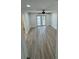 Bedroom featuring a ceiling fan, smooth floors, and bright light from the sliding glass doors at 3924 Orchard Hill Cir, Palm Harbor, FL 34684
