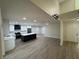 Modern kitchen with stainless steel appliances, white cabinets, an island and an open floor plan at 3924 Orchard Hill Cir, Palm Harbor, FL 34684