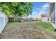Spacious backyard featuring a large shade tree, trampoline, and room for outdoor activities and play at 4010 Lithia Ridge Blvd, Valrico, FL 33596