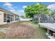 Large backyard with a trampoline, screened patio, and ample space for outdoor activities and recreation at 4010 Lithia Ridge Blvd, Valrico, FL 33596