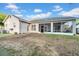 Spacious backyard with a screened lanai, perfect for outdoor entertaining and enjoying the Florida weather at 4010 Lithia Ridge Blvd, Valrico, FL 33596