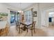 Charming dining area featuring a stylish table, backyard views, and access to the patio at 4010 Lithia Ridge Blvd, Valrico, FL 33596
