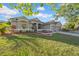 Charming single-story home with manicured lawn and tasteful landscaping, showcasing curb appeal at 4010 Lithia Ridge Blvd, Valrico, FL 33596