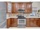 Bright kitchen features modern appliances, custom cabinetry, and stone countertops at 4010 Lithia Ridge Blvd, Valrico, FL 33596
