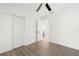 Bedroom featuring wood-look floors and open bathroom at 429 88Th Ave, St Pete Beach, FL 33706