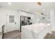 Modern kitchen featuring stainless steel appliances, sleek countertops, and an oversized island at 429 88Th Ave, St Pete Beach, FL 33706