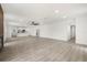 Open-concept space with new floors, fresh paint, modern lighting, connecting the living room and kitchen at 429 88Th Ave, St Pete Beach, FL 33706