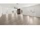 Spacious living room featuring new floors, fresh paint, a decorative fireplace, and modern lighting at 429 88Th Ave, St Pete Beach, FL 33706