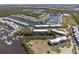 Expansive aerial showcasing a waterfront community with docks, a marina, and beautiful landscaping at 456 Bahia Beach Blvd, Ruskin, FL 33570