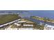 Beautiful aerial view of a waterfront community with a marina and waterfront condos, offering a serene coastal lifestyle at 456 Bahia Beach Blvd, Ruskin, FL 33570