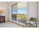 Comfortable furniture is placed on the balcony offering a view of the community at 456 Bahia Beach Blvd, Ruskin, FL 33570