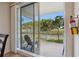 Enjoy picturesque water views from the private balcony, accessed through sliding glass doors at 456 Bahia Beach Blvd, Ruskin, FL 33570