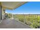 Scenic balcony view overlooking lush greenery with a partial view of a neighboring building at 456 Bahia Beach Blvd, Ruskin, FL 33570
