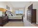 Relaxing main bedroom with dark wood furniture and sliding glass doors at 456 Bahia Beach Blvd, Ruskin, FL 33570