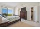 Bedroom features a dresser, outdoor view and closet, perfect for restful nights at 456 Bahia Beach Blvd, Ruskin, FL 33570