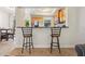 Bright kitchen view with countertop bar and stainless steel appliances, perfect for casual dining at 456 Bahia Beach Blvd, Ruskin, FL 33570