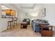 Spacious living area with an open kitchen layout and bar seating, great for entertaining at 456 Bahia Beach Blvd, Ruskin, FL 33570