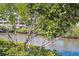 Picturesque view of the property's waterfront location surrounded by lush greenery at 456 Bahia Beach Blvd, Ruskin, FL 33570