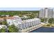 Aerial view featuring the building with waterfront access and balconies at 4950 Bayshore Blvd # 27, Tampa, FL 33611