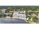 Aerial view showcases the complex with pool, waterfront and lush landscaping at 4950 Bayshore Blvd # 27, Tampa, FL 33611