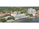 Stunning aerial view of waterfront condos featuring a community pool and meticulously maintained landscaping at 4950 Bayshore Blvd # 27, Tampa, FL 33611