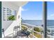Cozy balcony with seating and a beautiful view of the water and cityscape at 4950 Bayshore Blvd # 27, Tampa, FL 33611