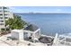 Breathtaking condo terrace with covered seating, waterfront views, and stylish decor at 4950 Bayshore Blvd # 27, Tampa, FL 33611