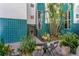 Inviting courtyard featuring tropical plants, seating, and unique exterior finishes at 4950 Bayshore Blvd # 27, Tampa, FL 33611
