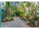 Lush courtyard with tables, seating, and verdant foliage for a peaceful community retreat at 4950 Bayshore Blvd # 27, Tampa, FL 33611